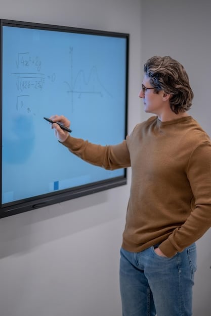 A teacher demonstrating the use of a digital textbook on a large interactive whiteboard, with students actively participating and engaging with the lesson. The focus is on the collaborative learning environment.