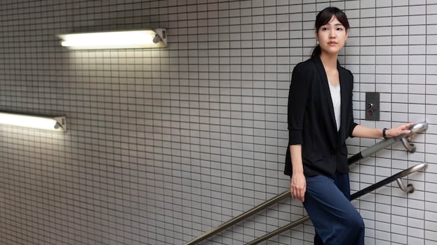 A Japanese businesswoman confidently presenting a project in a modern, minimalist office. She is wearing stylish, semi-formal attire that reflects the relaxed yet professional dress code.