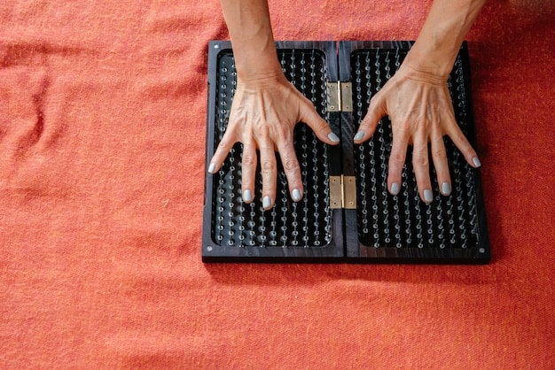 A close-up of a musician's hands playing a digital instrument that combines traditional Japanese musical elements with electronic interfaces. The instrument glows with soft, colorful lights, and the background is blurred to focus on the musician's skilled performance.